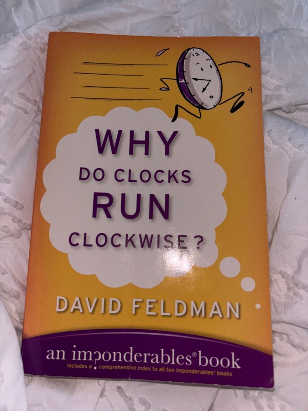 Amazon Yellow and Purple 'Why Do Clocks Run Clockwise?' Notebook